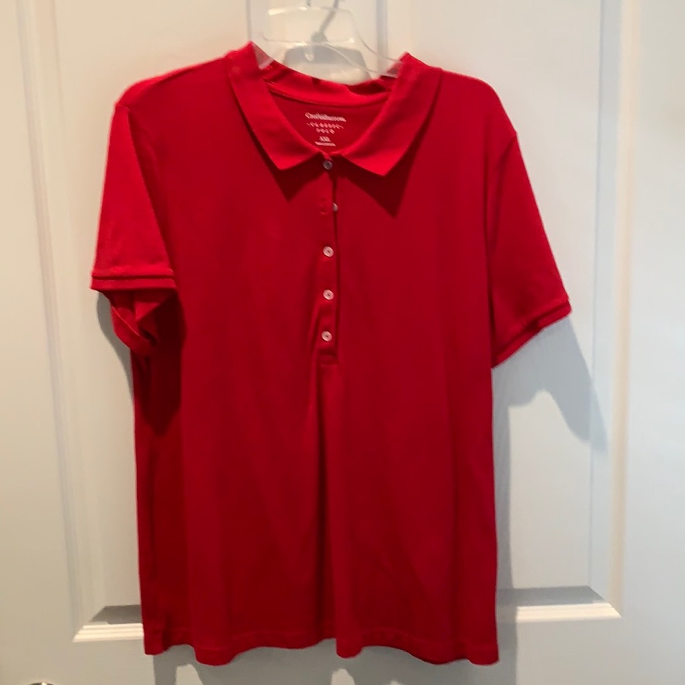 Women’s short sleeve polo style shirt.